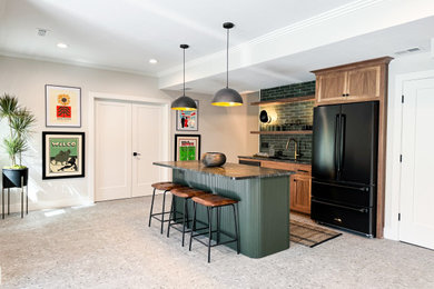Home bar photo in Kansas City with green cabinets, green backsplash and black countertops