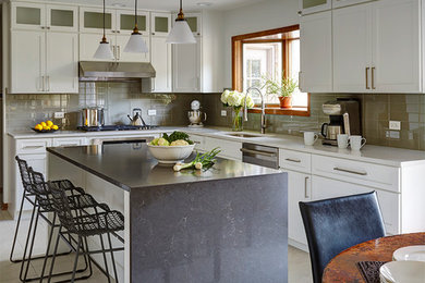Example of a large trendy galley porcelain tile eat-in kitchen design in Chicago with an undermount sink, recessed-panel cabinets, white cabinets, quartz countertops, gray backsplash, glass tile backsplash, stainless steel appliances and an island
