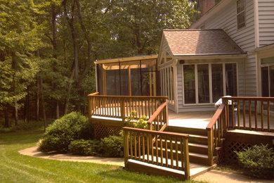 Design ideas for a large arts and crafts backyard deck in Baltimore with an awning.