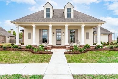 Example of a french country exterior home design in New Orleans