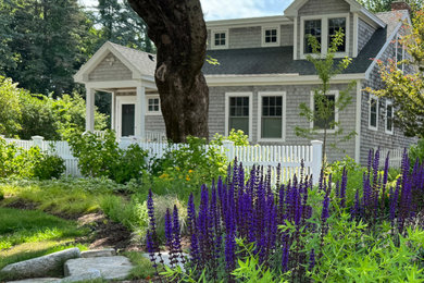 Example of a transitional home design design in Portland Maine