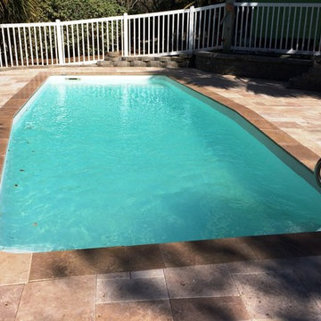 Emerald Isle pool transformation - old concrete pool deck to travertine