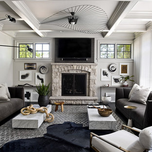 Trendy formal and enclosed living room photo in Chicago with gray walls, a standard fireplace, a stone fireplace and a wall-mounted tv