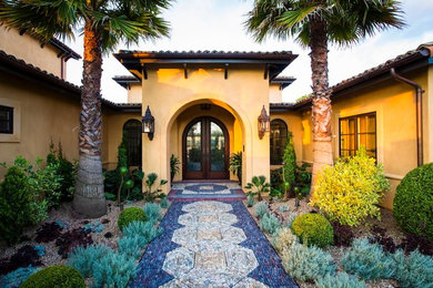 Inspiration for an entryway remodel in San Francisco with yellow walls and a brown front door
