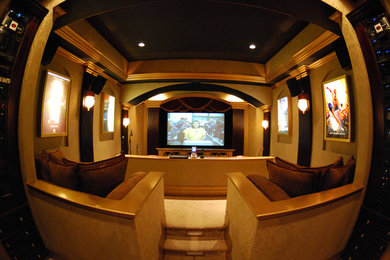 Large transitional enclosed carpeted and beige floor home theater photo in New York with brown walls and a projector screen