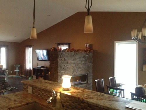 Help me find decor for fireplace with vaulted ceiling please?