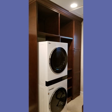 Custom Built‑In Shaker Laundry Cabinets in Mahogany on Maple
