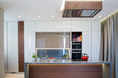 This is an example of a contemporary kitchen in Surrey.