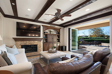 Example of a transitional family room design in Orange County