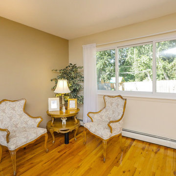 Elegant Living Room with Large Sliding Window - Renewal by Andersen NY