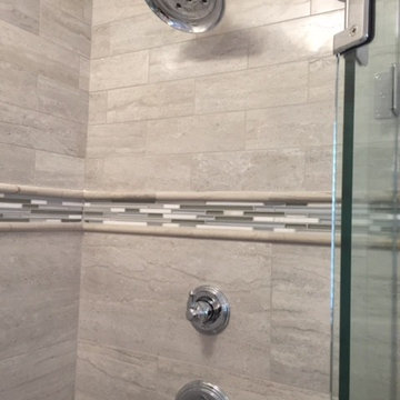 Glass tile accent band in shower