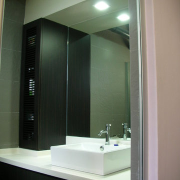 Vanity with storage cabinet and mirror.
