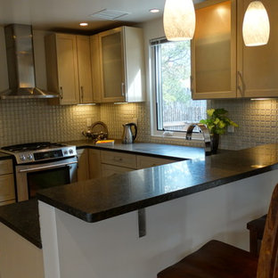 Mid-sized contemporary kitchen pantry ideas - Kitchen pantry - mid-sized contemporary u-shaped light wood floor kitchen pantry idea in Albuquerque with shaker cabinets, beige cabinets, solid surface countertops, beige backsplash, cement tile backsplash, stainless steel appliances and no island