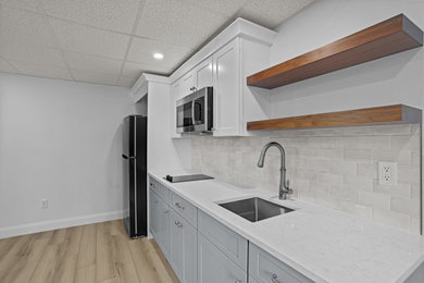 Example of a mid-sized trendy single-wall home bar design in Providence