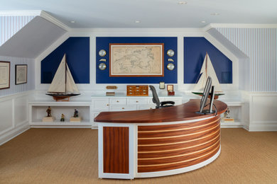 This is an example of a beach style home office in Boston.