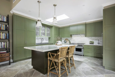 This is an example of a mid-sized traditional l-shaped eat-in kitchen in Sydney with green cabinets, an undermount sink, shaker cabinets, marble benchtops, grey splashback, marble splashback, stainless steel appliances, limestone floors, with island, grey floor and grey benchtop.