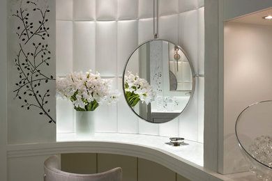 This is an example of a mid-sized contemporary powder room in Miami with white tile, flat-panel cabinets, white cabinets, white walls, marble floors, marble benchtops and grey floor.