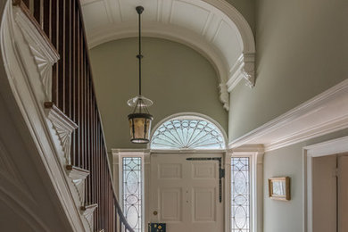 Design ideas for a large traditional wood curved staircase in Providence with painted wood risers.