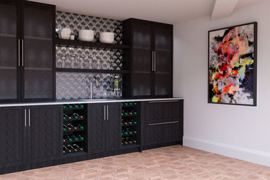 Mid-sized minimalist single-wall light wood floor and brown floor wet bar photo in Toronto with an undermount sink, shaker cabinets, dark wood cabinets, concrete countertops, multicolored backsplash, metal backsplash and gray countertops