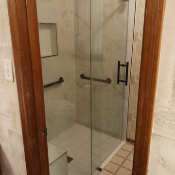 ADA  Shower build up. after shower was completed with glass