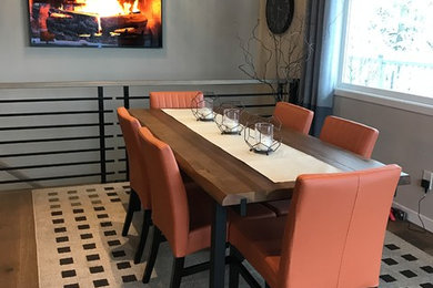 Mid-sized transitional medium tone wood floor kitchen/dining room combo photo in Boise with gray walls and no fireplace