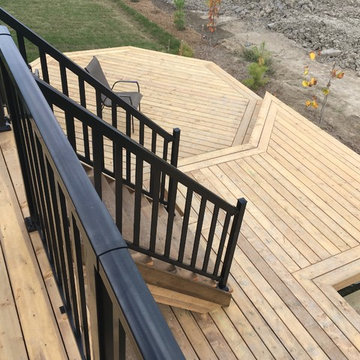 Multiple levels deck with a storage space and a hut-tub place