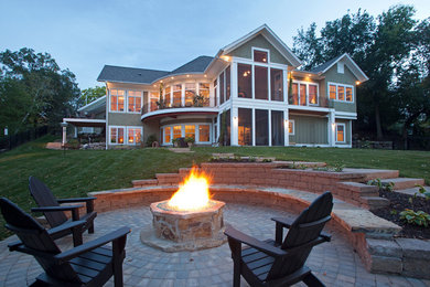 Inspiration for a huge green three-story exterior home remodel in Minneapolis