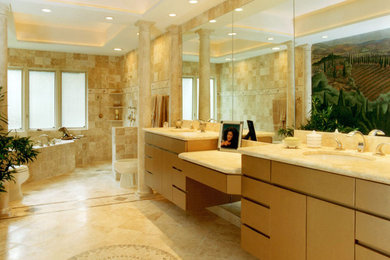 Huge minimalist beige tile travertine floor bathroom photo in Austin with an undermount sink, flat-panel cabinets, beige cabinets, quartz countertops, a two-piece toilet and beige walls