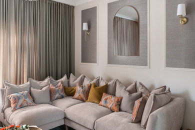 Mid-sized minimalist open concept carpeted, beige floor and wallpaper living room photo in London with beige walls and a media wall