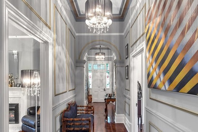 This is an example of a traditional hallway in Adelaide with grey walls, medium hardwood floors and brown floor.