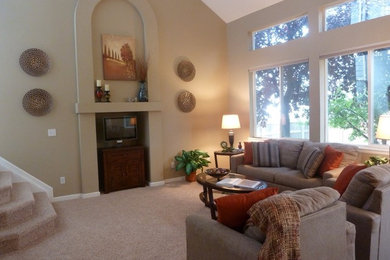 Example of a transitional family room design in Denver