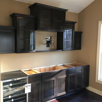 Staggered uppers with full overlay glass doors.