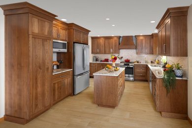 Example of a transitional porcelain tile kitchen design in Other with recessed-panel cabinets, medium tone wood cabinets, granite countertops, ceramic backsplash and an island