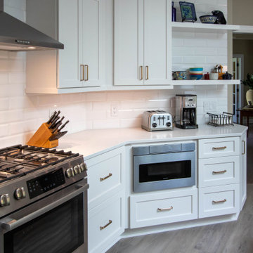 3 Finishes on Kitchen Cabinetry with Galley Workstation in Island and Wine Bar