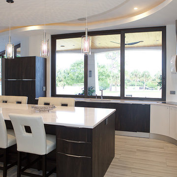 LARGE PICTURE WINDOW ABOVE SINK OVERSEEING WATERWAYS AND POOL AREA