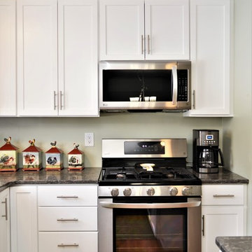 St. John, IN. Haas Lifestyle Collection. Open White Maple Kitchen