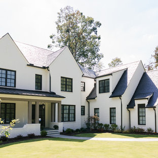 На фото: трехэтажный фасад частного дома среднего размера белого цвета в стиле современная классика с облицовкой из кирпича, двускатной крышей и крышей из смешанных материалов с