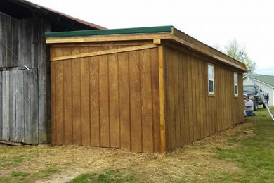 Example of a country exterior home design in Other