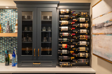 Inspiration for a mid-sized coastal galley vinyl floor and beige floor wet bar remodel in Other with an undermount sink, flat-panel cabinets, blue cabinets, quartz countertops, white backsplash, glass tile backsplash and beige countertops