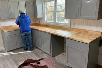 Example of a mid-sized farmhouse kitchen design in Other