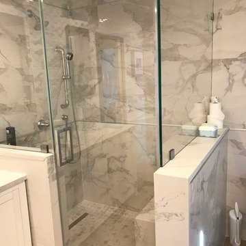White Master Bath using a mix of Quartz, Porcelain tile and Natural stone mosaic