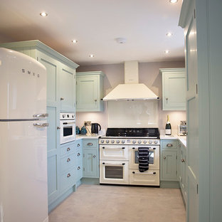 Small contemporary kitchen pantry ideas - Kitchen pantry - small contemporary u-shaped kitchen pantry idea in Cheshire with an undermount sink, shaker cabinets, quartzite countertops, glass sheet backsplash and colored appliances