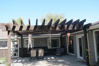 Example of a large mountain style exterior home design in Other