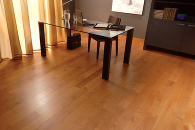 Large minimalist freestanding desk light wood floor study room photo in Other with gray walls