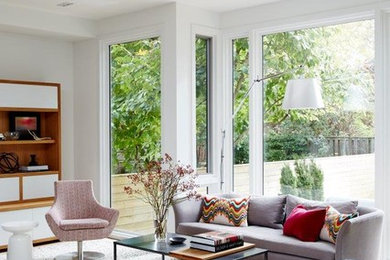 Large minimalist open concept carpeted family room photo in Toronto with white walls and a media wall