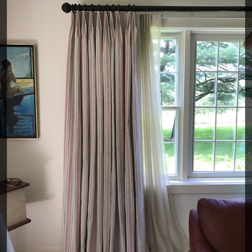 Tightly stacked drapery to preserve view.