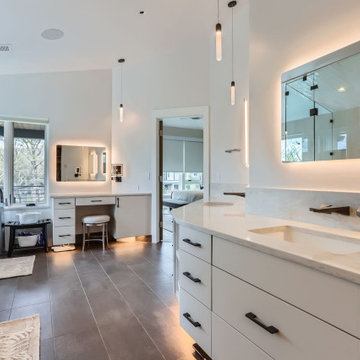 Modern Spa-Inspired Primary Bathroom with Custom Lighting and Views