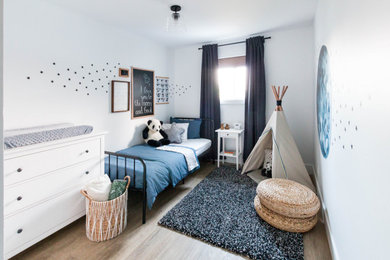 Inspiration for a mid-sized modern boy vinyl floor and brown floor kids' room remodel in Calgary with white walls