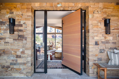 Example of a huge eclectic home design design in Phoenix