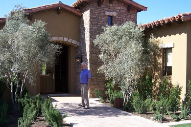 Photo of an expansive mediterranean one-storey exterior in Los Angeles.